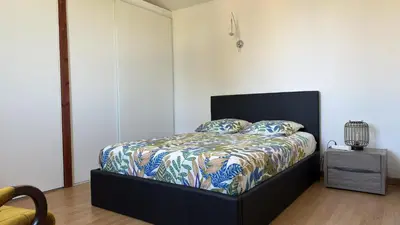 Un ou plusieurs lits dans un hébergement de l'établissement Appartement Maenat