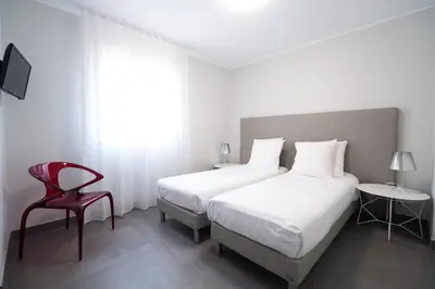 Un ou plusieurs lits dans un hébergement de l'établissement Residence Saletta Casale