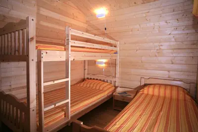 Un ou plusieurs lits dans un hébergement de l'établissement Camping Les Oliviers