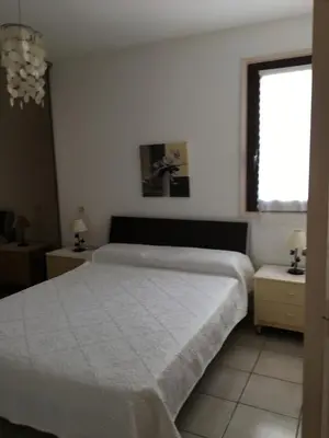 Un ou plusieurs lits dans un hébergement de l'établissement Rez de Villa Vue Mer Panoramique