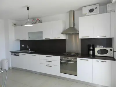Cuisine ou kitchenette dans l'établissement Apartment Lup - Les terrasses d'Alistro by Interhome