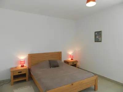 Un ou plusieurs lits dans un hébergement de l'établissement Apartment Lup - Les terrasses d'Alistro by Interhome