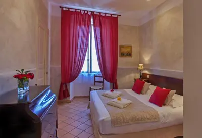 Un ou plusieurs lits dans un hébergement de l'établissement Mare E Monti - Hôtel de Charme
