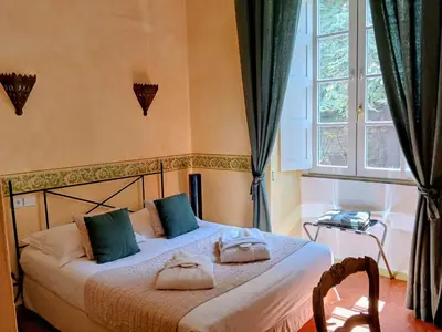 Un ou plusieurs lits dans un hébergement de l'établissement Mare E Monti - Hôtel de Charme