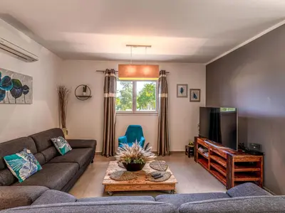 Coin salon dans l'établissement Holiday Home Villa Marie-Jo by Interhome