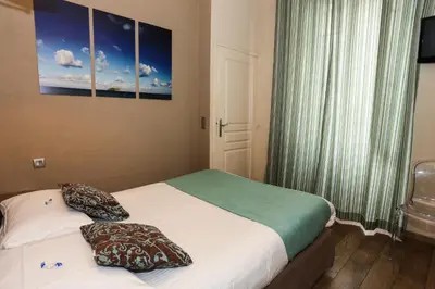 Un ou plusieurs lits dans un hébergement de l'établissement Hôtel Duc De Padoue