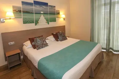 Un ou plusieurs lits dans un hébergement de l'établissement Hôtel Duc De Padoue