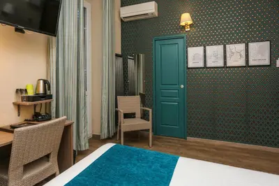 Un ou plusieurs lits dans un hébergement de l'établissement Hôtel Duc De Padoue
