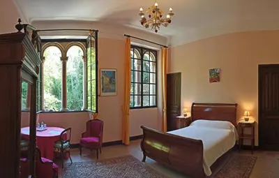 Un ou plusieurs lits dans un hébergement de l'établissement CHÂTEAU CAGNINACCI B&B