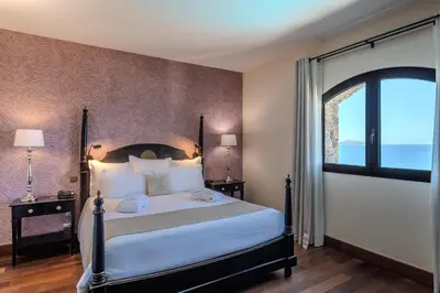 Un ou plusieurs lits dans un hébergement de l'établissement Hôtel Demeure Loredana