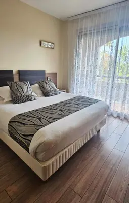 Un ou plusieurs lits dans un hébergement de l'établissement Hotel Poretta