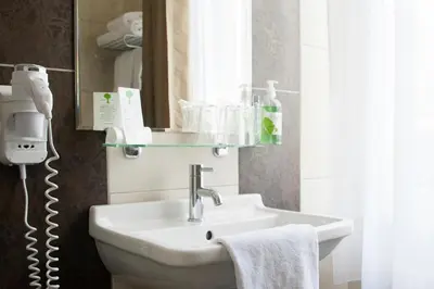 Salle de bains dans l'établissement Splendid Hôtel