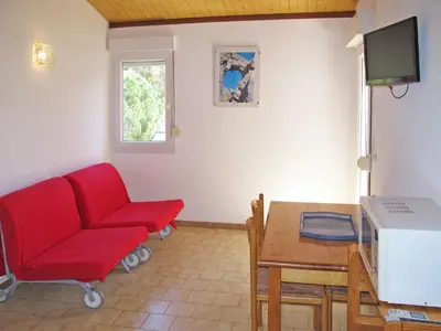 Télévision ou salle de divertissement dans l'établissement Apartment Thalassa-1 by Interhome