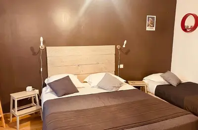 Un ou plusieurs lits dans un hébergement de l'établissement Hôtel U Passa Tempu