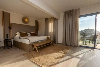 Un ou plusieurs lits dans un hébergement de l'établissement Hotel L'Acquale
