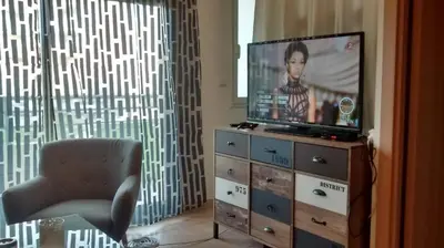 Télévision ou salle de divertissement dans l'établissement Victoria