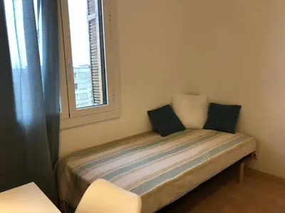 Un ou plusieurs lits dans un hébergement de l'établissement Appartement Casella
