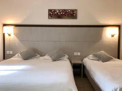 Un ou plusieurs lits dans un hébergement de l'établissement Hotel et Résidence Cala di sole