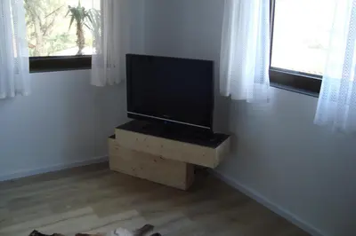 Télévision ou salle de divertissement dans l'établissement Rustica