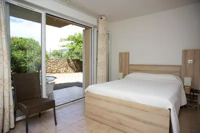 Un ou plusieurs lits dans un hébergement de l'établissement Motel le Vieux Moulin