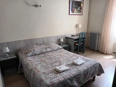 Un ou plusieurs lits dans un hébergement de l'établissement Hotel de La Paix