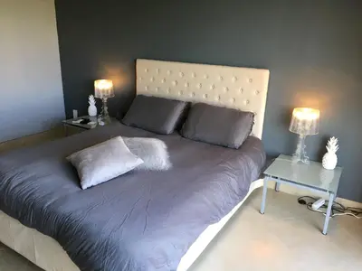 Un ou plusieurs lits dans un hébergement de l'établissement Chambre Élégante Lisa