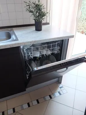 Cuisine ou kitchenette dans l'établissement Chez Valérie et Stéphane, Les terrasses de Lozari