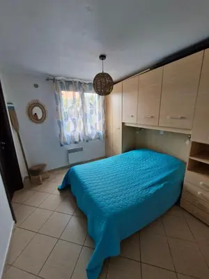 Un ou plusieurs lits dans un hébergement de l'établissement Chez Valérie et Stéphane, Les terrasses de Lozari