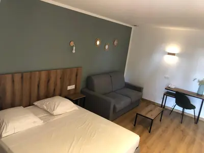 Un ou plusieurs lits dans un hébergement de l'établissement Auberge les Oliviers