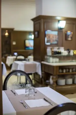 Restaurant ou autre lieu de restauration dans l'établissement Hôtel Les Voyageurs