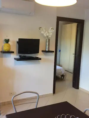 Télévision ou salle de divertissement dans l'établissement Appartement June
