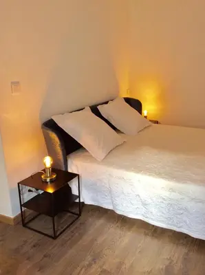Un ou plusieurs lits dans un hébergement de l'établissement Appartement Doria