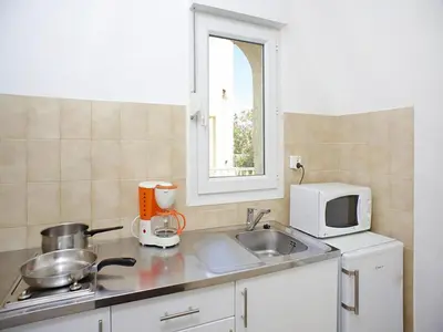 Cuisine ou kitchenette dans l'établissement Res Le Vieux Moulin Ile Rousse, Apartment for 4 pers