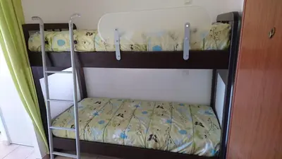 Un ou plusieurs lits dans un hébergement de l'établissement Studio 4 personnes à Calvi, toutes commodités à pied