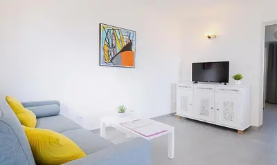 Télévision ou salle de divertissement dans l'établissement Locations 