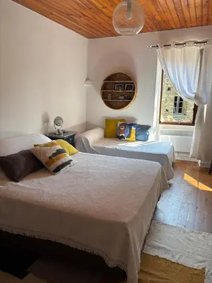 Un ou plusieurs lits dans un hébergement de l'établissement Maison de village