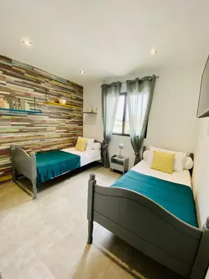 Un ou plusieurs lits dans un hébergement de l'établissement Villa entre Mer et Montagne...