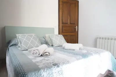 Un ou plusieurs lits dans un hébergement de l'établissement Appartement Gaudin