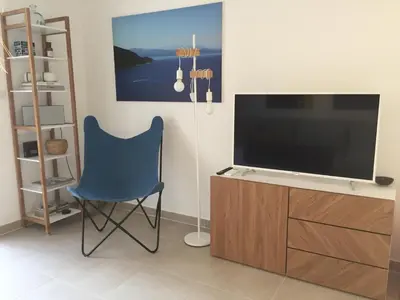 Télévision ou salle de divertissement dans l'établissement Domaine A Mortella T2