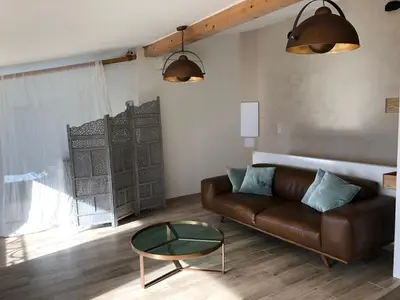 Coin salon dans l'établissement CORSE - Lumio, Balagne petite maison loft, vue imprenable sur le Golfe de Calvi