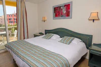 Un ou plusieurs lits dans un hébergement de l'établissement Hotel Saint Christophe