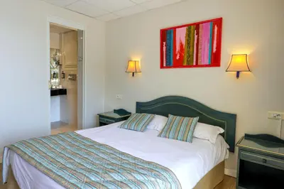 Un ou plusieurs lits dans un hébergement de l'établissement Hotel Saint Christophe
