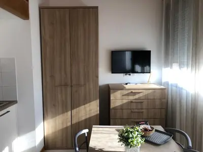 Télévision ou salle de divertissement dans l'établissement Résidence Porto Marine