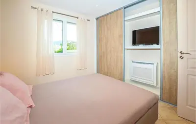 Un ou plusieurs lits dans un hébergement de l'établissement Cozy Home In Algajola With Wifi