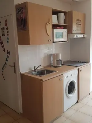 Cuisine ou kitchenette dans l'établissement Domaine de Mélody