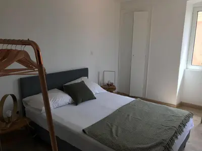 Un ou plusieurs lits dans un hébergement de l'établissement Appartement à Ile Rousse