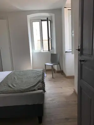 Un ou plusieurs lits dans un hébergement de l'établissement Appartement à Ile Rousse