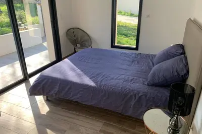 Un ou plusieurs lits dans un hébergement de l'établissement VILLA BENOA