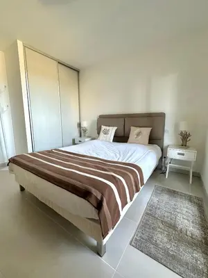 Un ou plusieurs lits dans un hébergement de l'établissement Appartement CUMARU vue mer