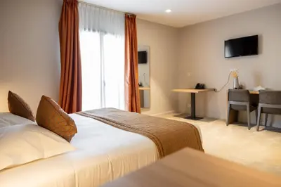 Un ou plusieurs lits dans un hébergement de l'établissement Hôtel Le Bastia